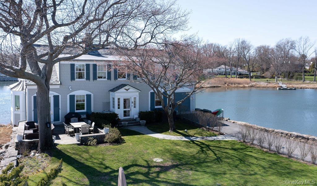 6 Pine Island Road Rye, NY 10580 - Photo 34 of 38 a front view of a house with garden yard and sitting area