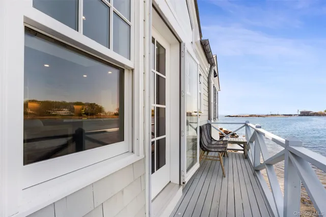 a view of a livingroom with workspace and a window