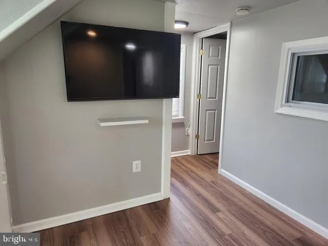 a view of a livingroom with wooden floor