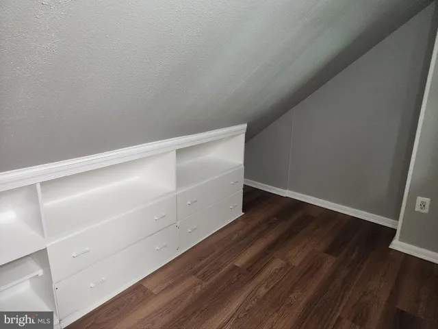 a view of an empty walk in closet