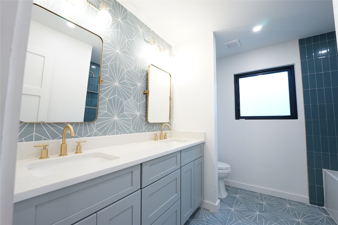 8006 Tiffany Drive Austin, TX 78749 - Photo 12 of 22 a bathroom with a sink and a mirror