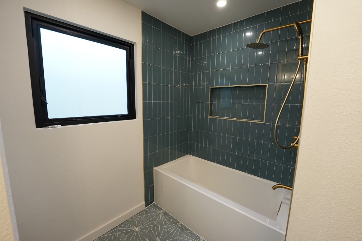 8006 Tiffany Drive Austin, TX 78749 - Photo 13 of 22 a bathroom with a bathtub and a shower