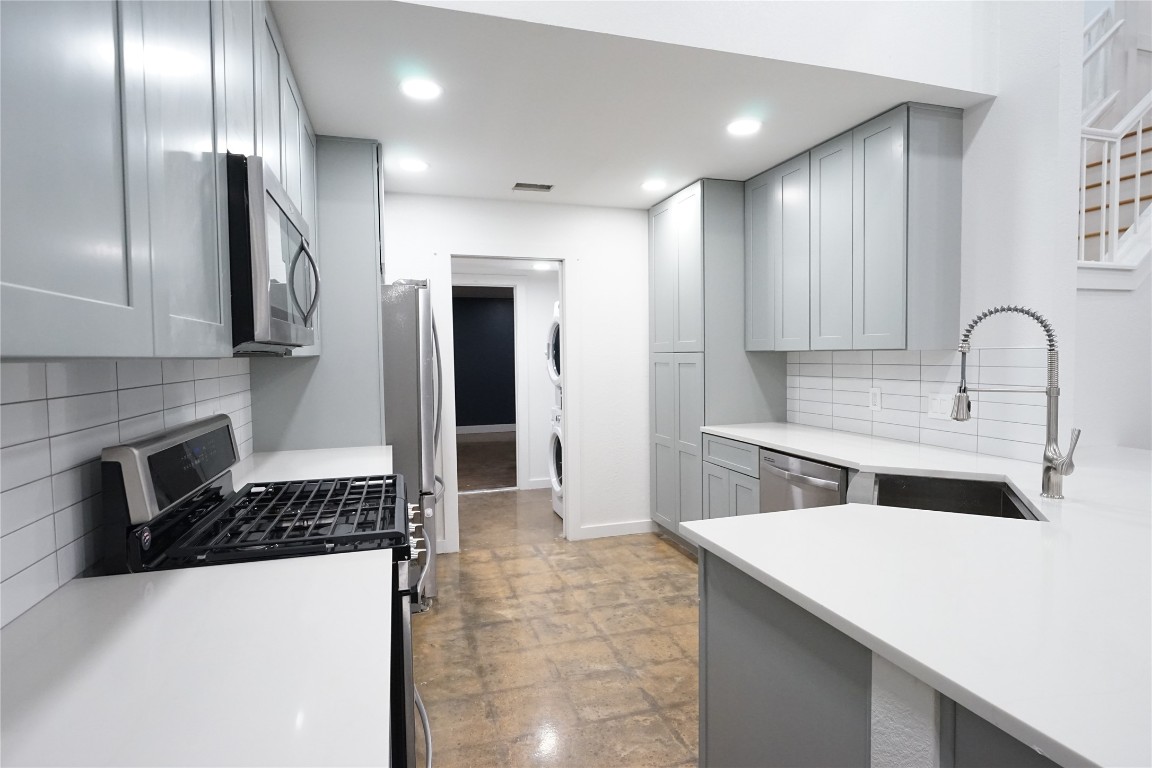 8006 Tiffany Drive Austin, TX 78749 - Photo 15 of 22 a kitchen with a sink cabinets and stainless steel appliances