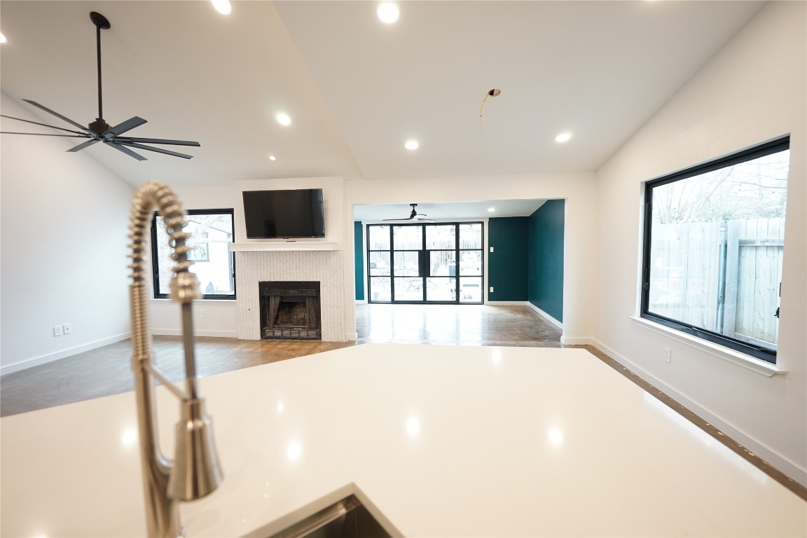 8006 Tiffany Drive Austin, TX 78749 - Photo 21 of 22 a large white bedroom with a fireplace and a flat screen tv