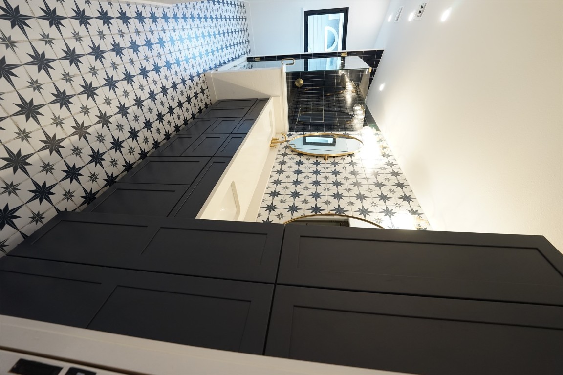 8006 Tiffany Drive Austin, TX 78749 - Photo 6 of 22 a bathroom with a sink a toilet and mirror