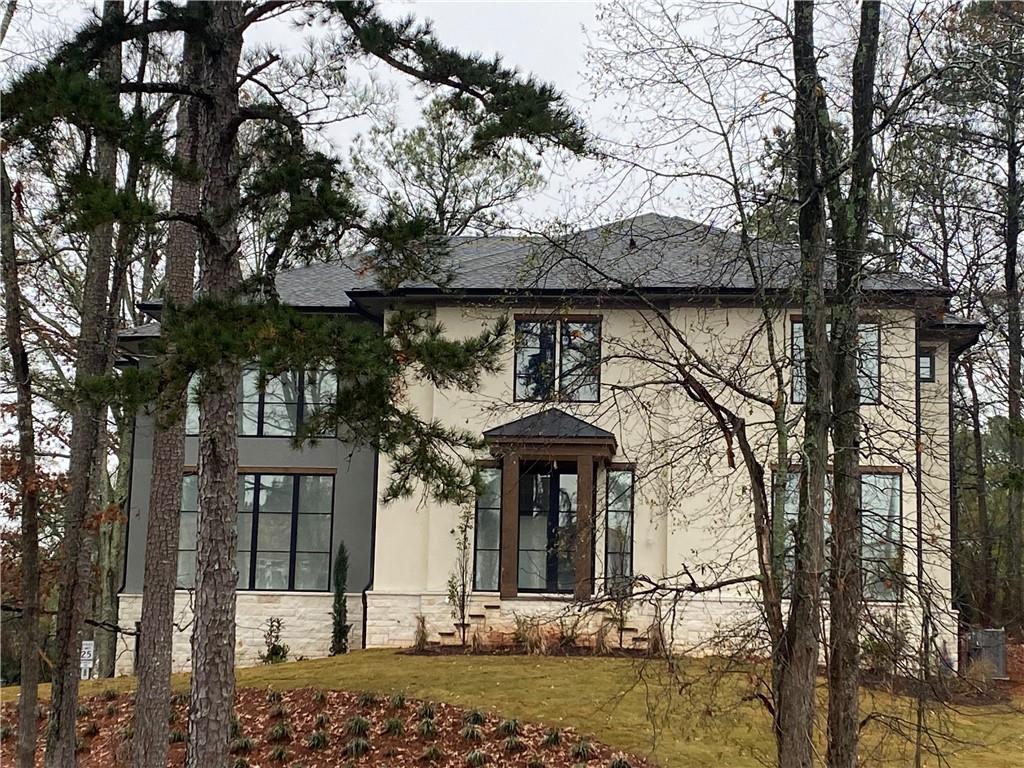a front view of a house with garden