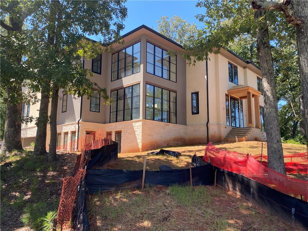 174 Devore Road Alpharetta, GA 30009 - Photo 2 of 10 a backyard of a house with table and chairs