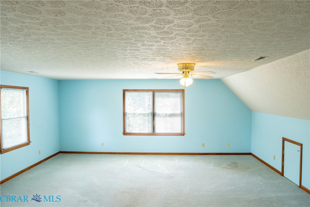 2847 Decatur Drive Hayes, VA 23072 - Photo 17 of 30 Additional living space with carpet flooring and ceiling fan
