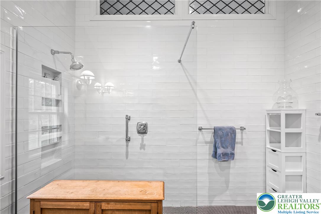 1072 5 Points Richmond Road Bangor, PA 18013 - Photo 60 of 66 This sleek shower space features classic white subway tiles and a practical shower niche.