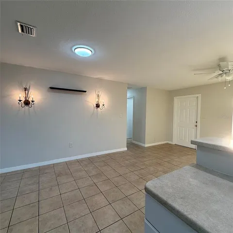 a bathroom with a granite countertop toilet a sink and bathtub