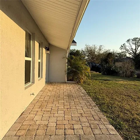 a view of a pathway both side of the house