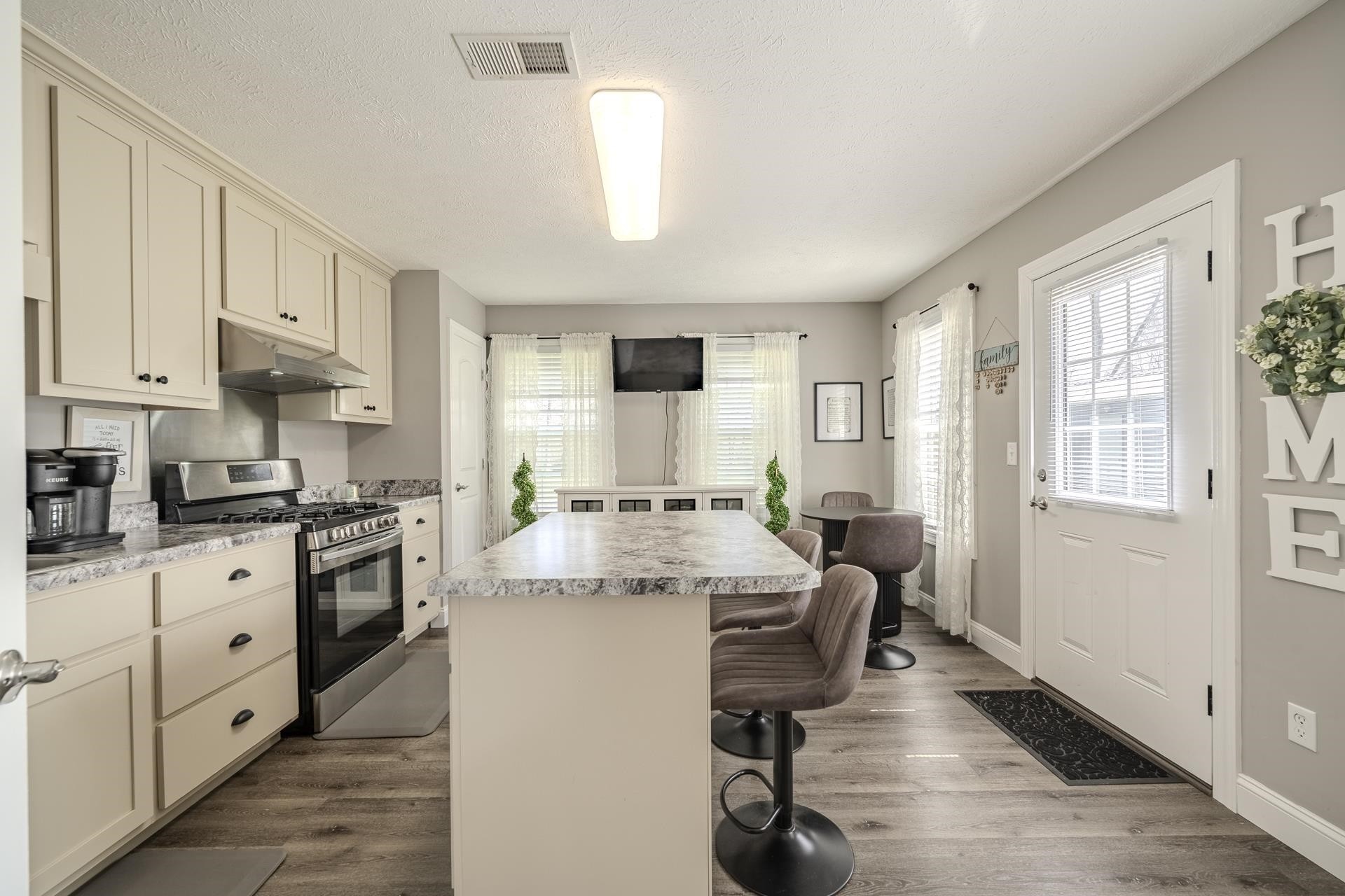 50 Perry Place Savannah, TN 38372 - Photo 12 of 38 a kitchen with granite countertop white cabinets and white appliances
