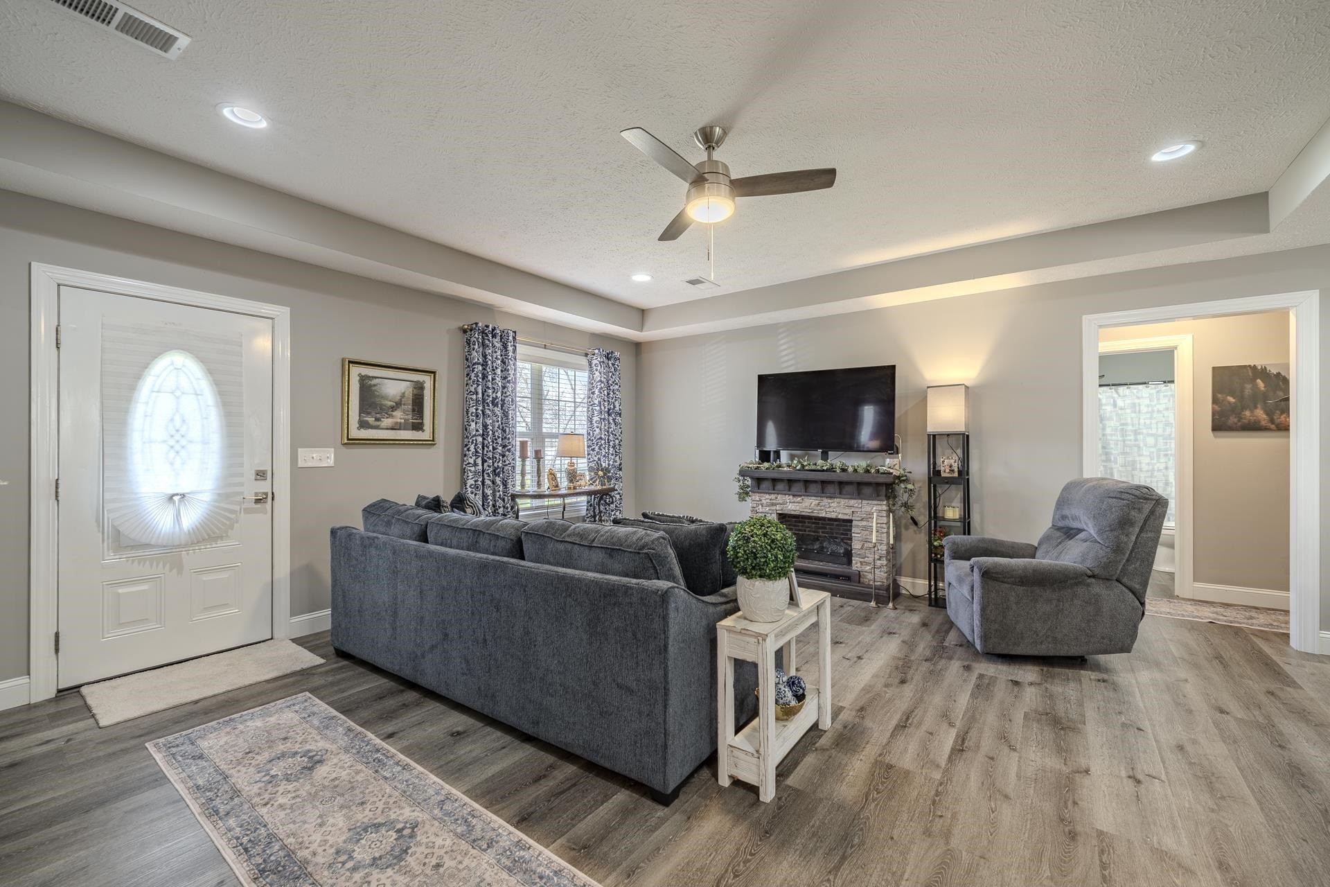 50 Perry Place Savannah, TN 38372 - Photo 17 of 38 a living room with furniture and a flat screen tv