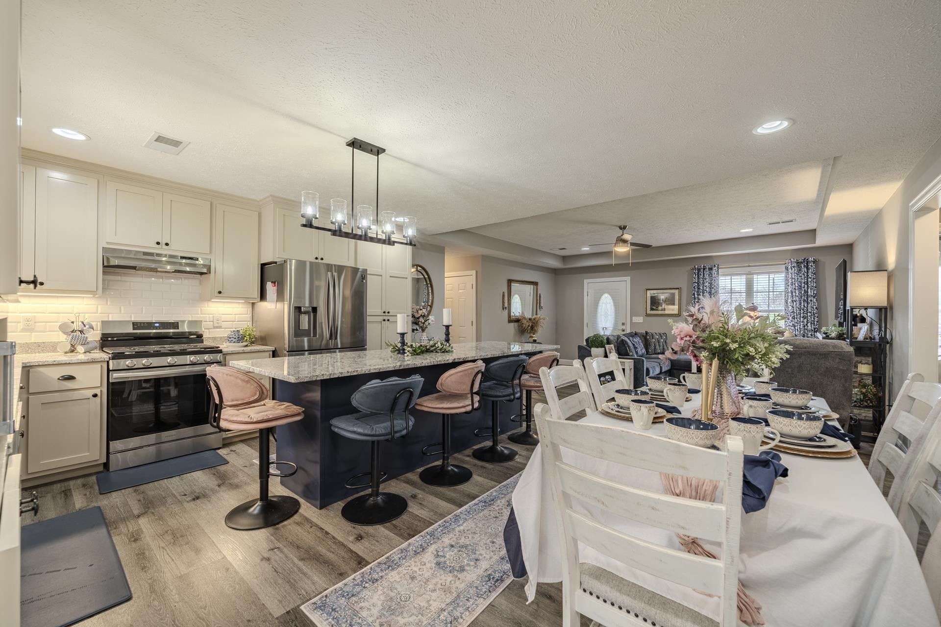 50 Perry Place Savannah, TN 38372 - Photo 2 of 38 a view of a dining room and livingroom with furniture wooden floor a chandelier