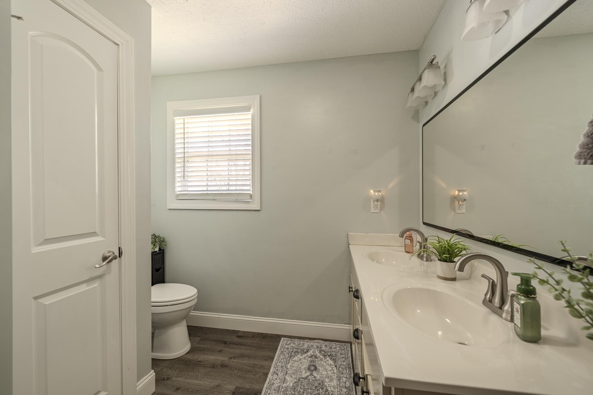 50 Perry Place Savannah, TN 38372 - Photo 22 of 38 a bathroom with a sink and mirror with toilet