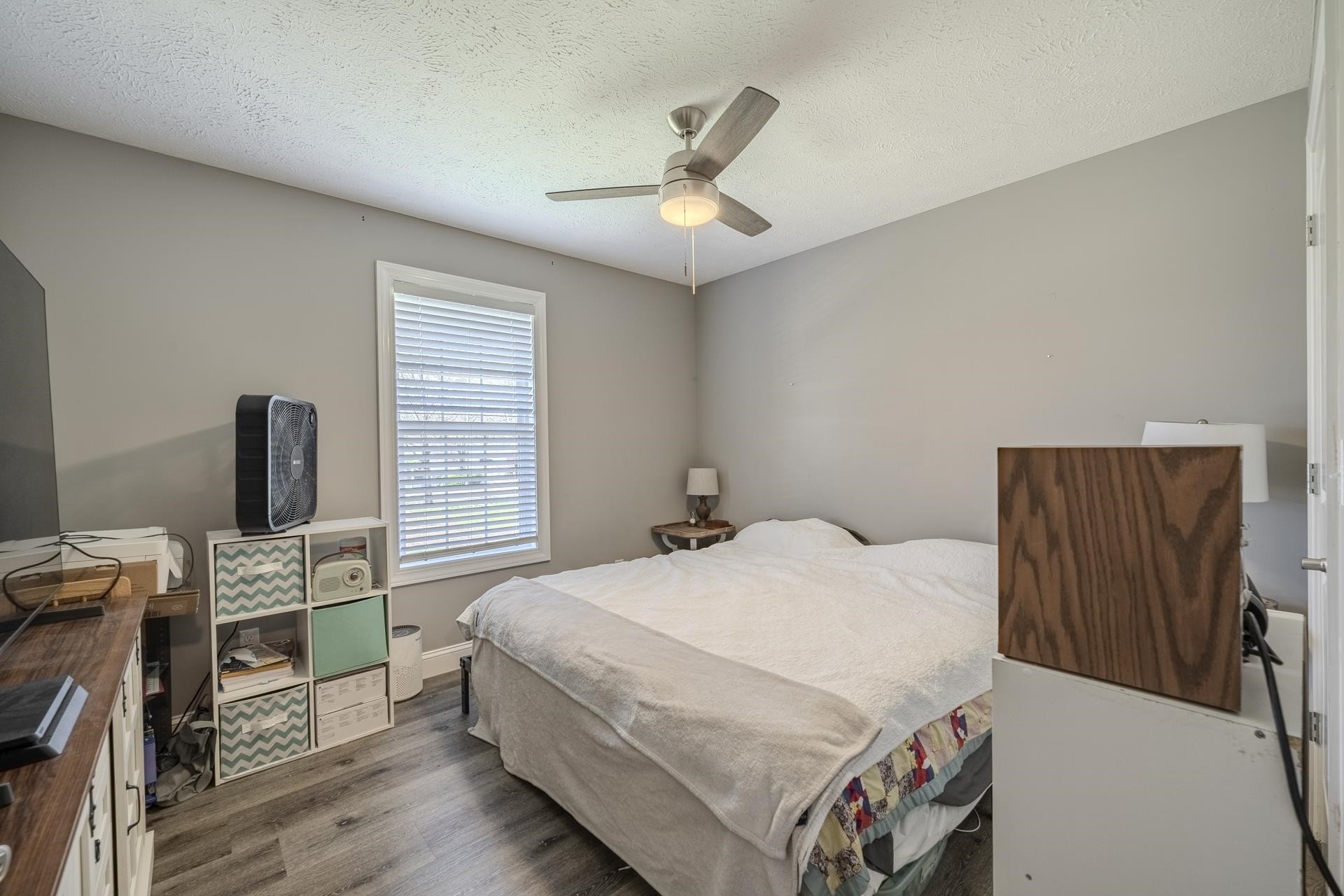 50 Perry Place Savannah, TN 38372 - Photo 23 of 38 a bedroom with a bed and a flat tv screen on the dresser