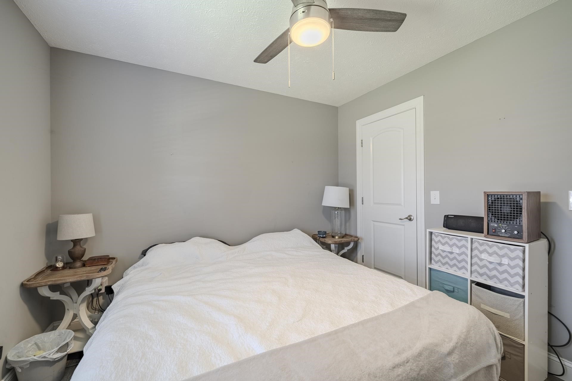 50 Perry Place Savannah, TN 38372 - Photo 24 of 38 a bedroom with a bed and a fireplace