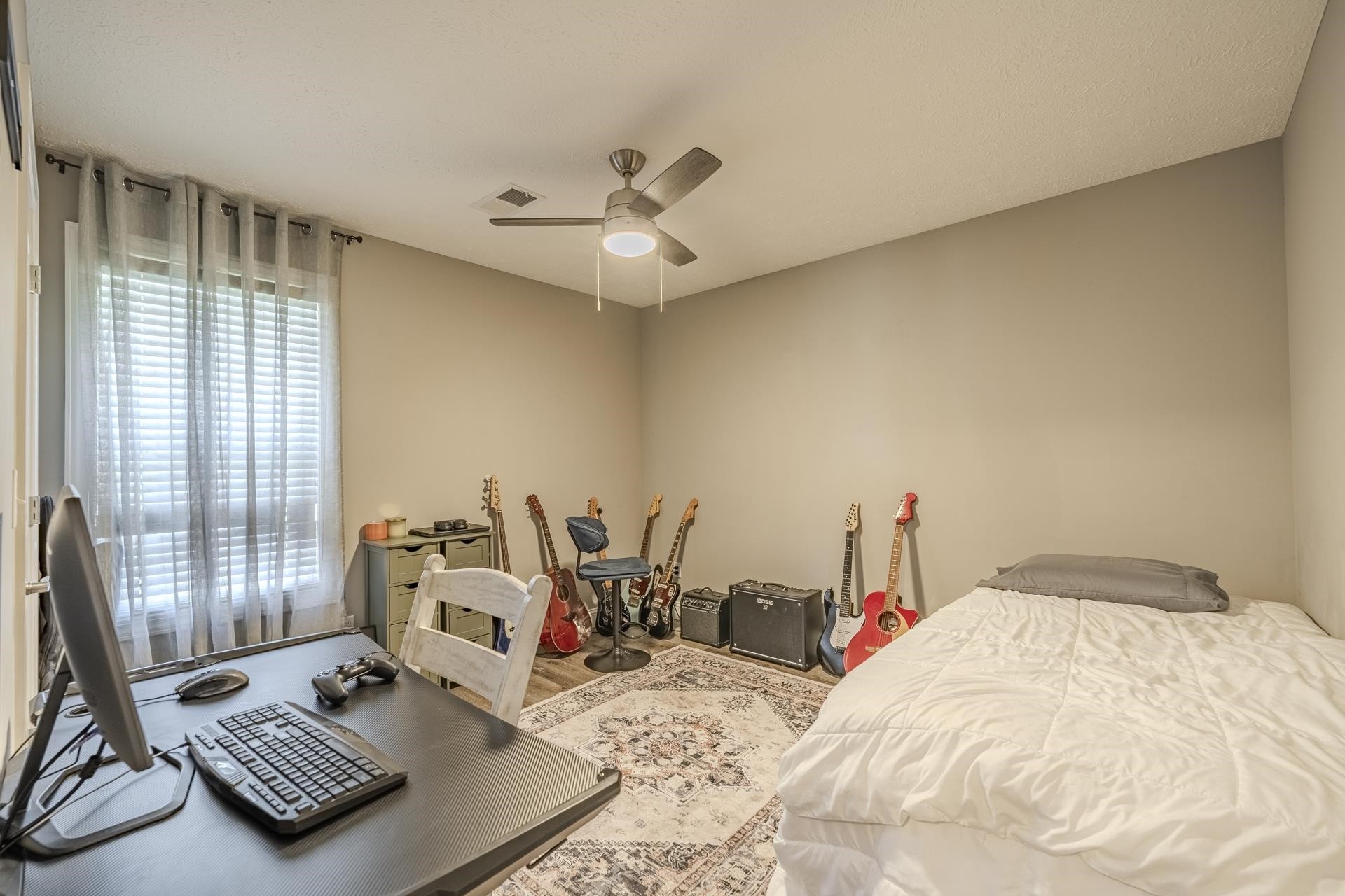 50 Perry Place Savannah, TN 38372 - Photo 25 of 38 a bedroom with a bed and wooden floor