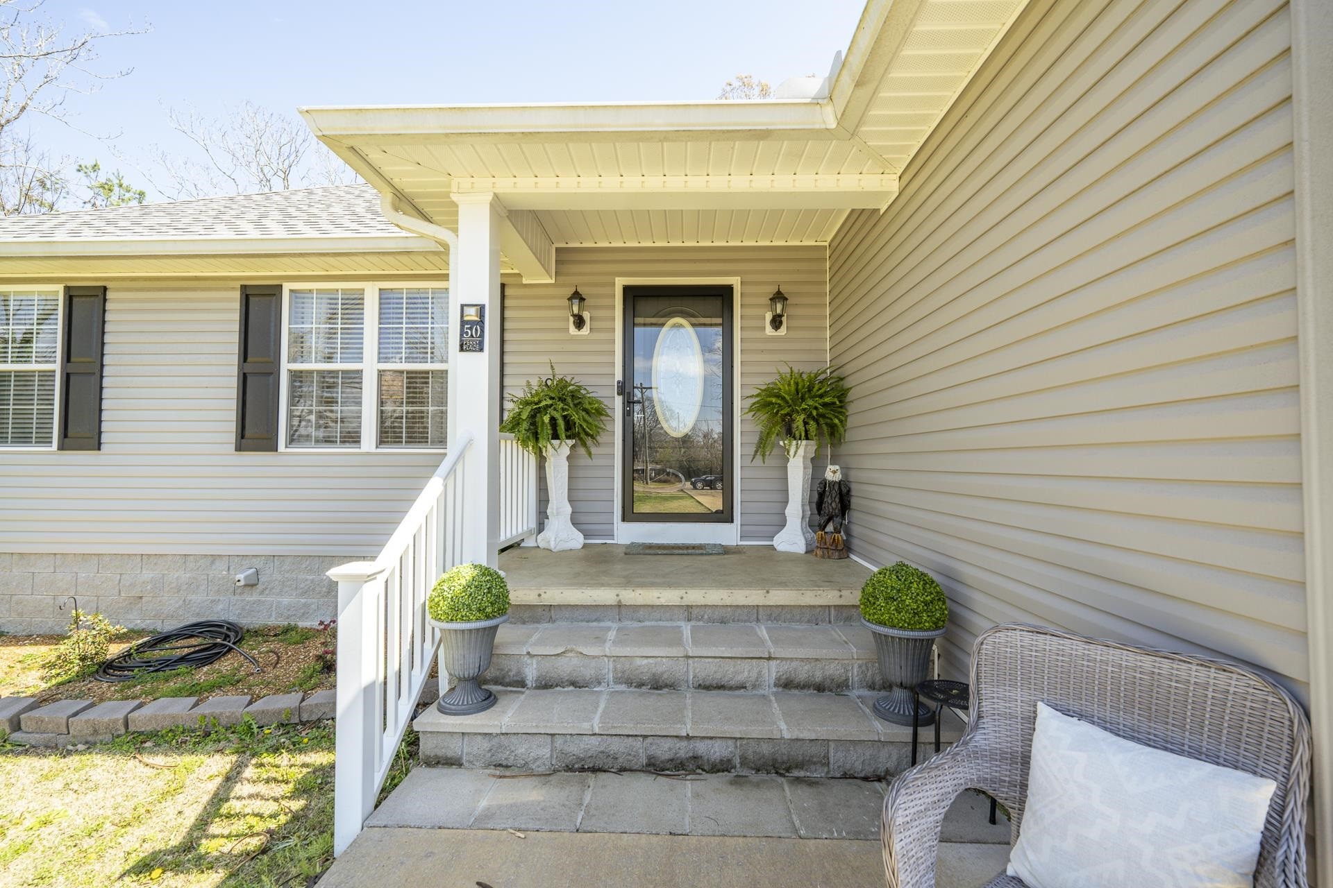 50 Perry Place Savannah, TN 38372 - Photo 31 of 38 a front view of a house with potted plants