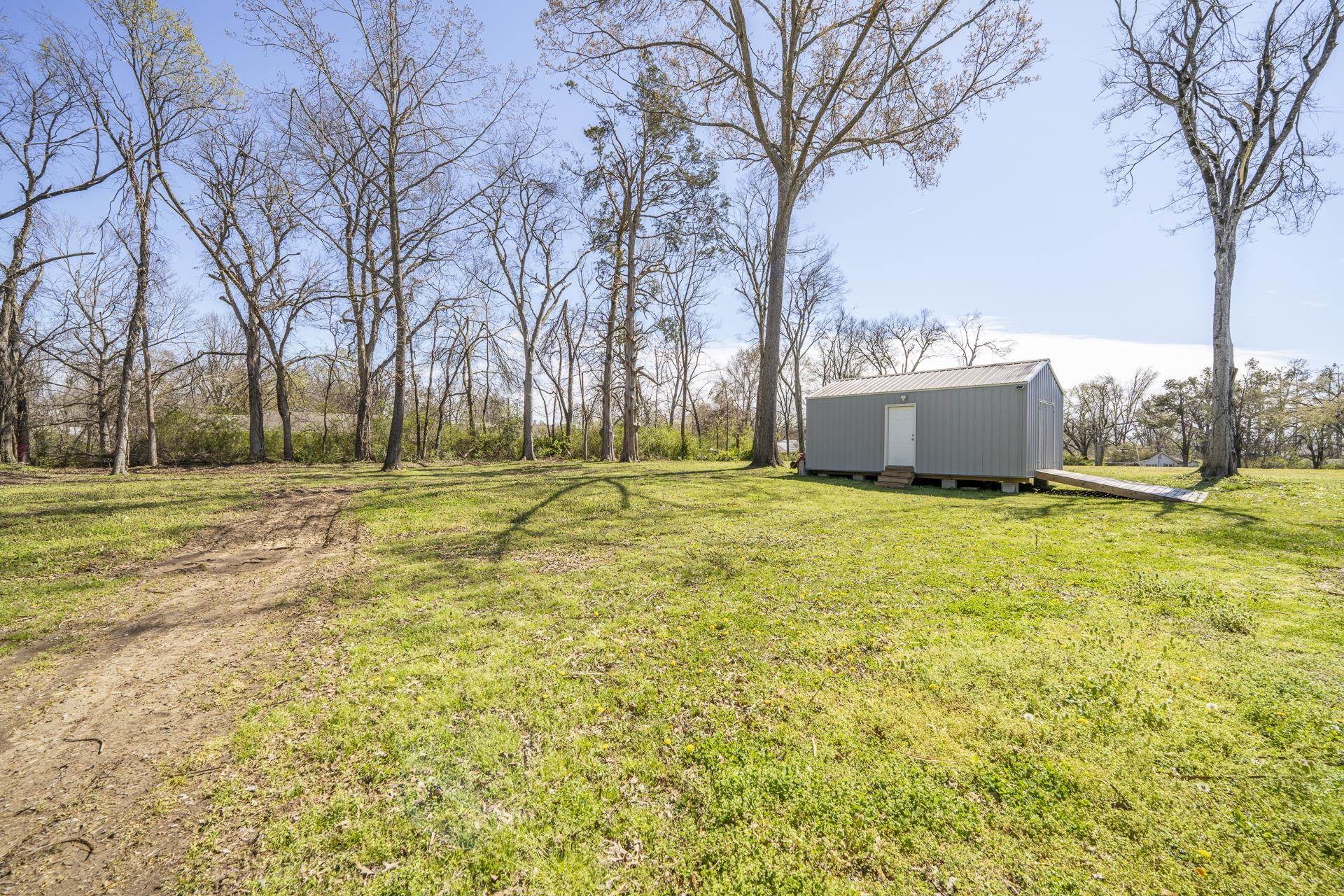 50 Perry Place Savannah, TN 38372 - Photo 32 of 38 a view of a house with a yard