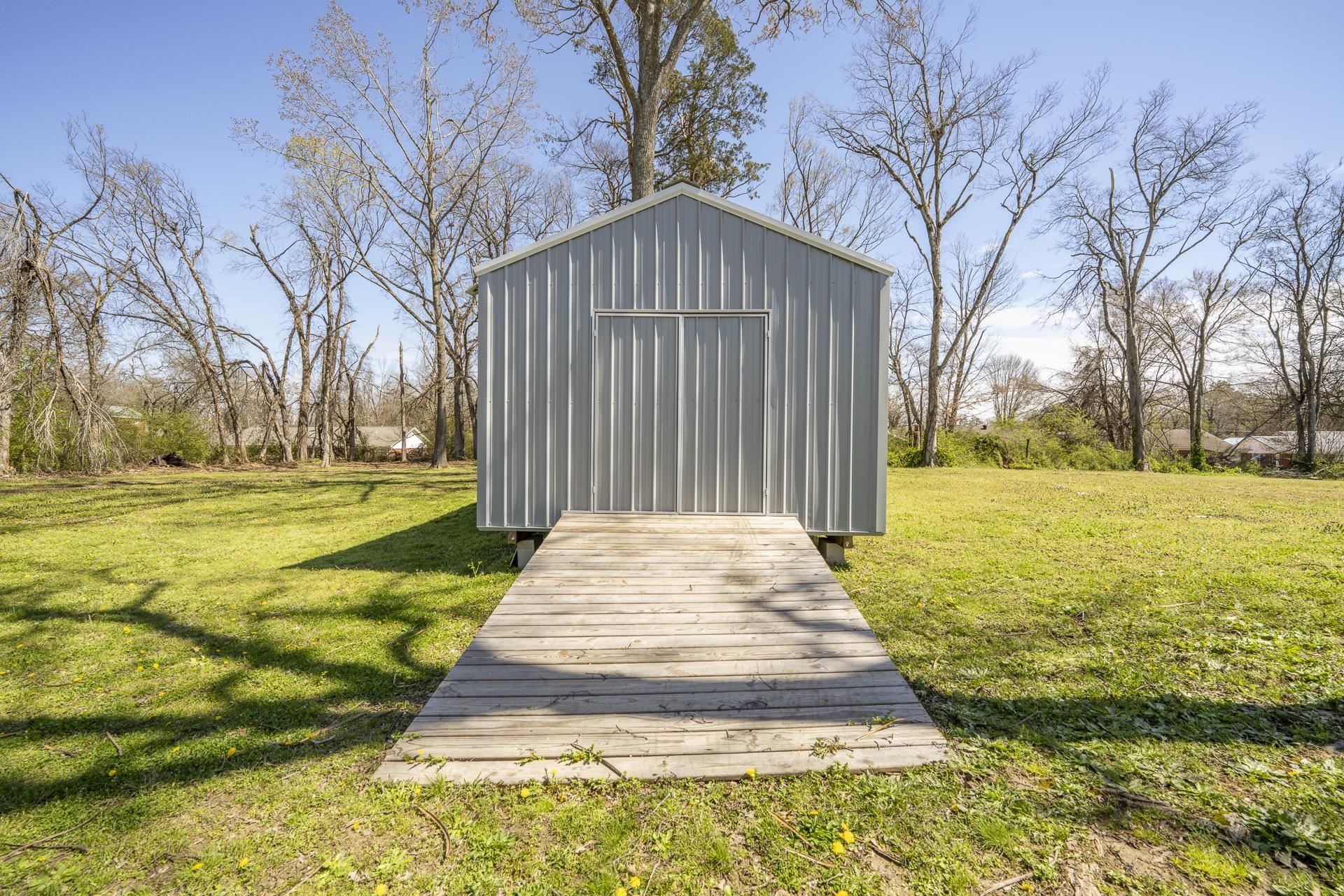 50 Perry Place Savannah, TN 38372 - Photo 33 of 38 a front view of building with yard