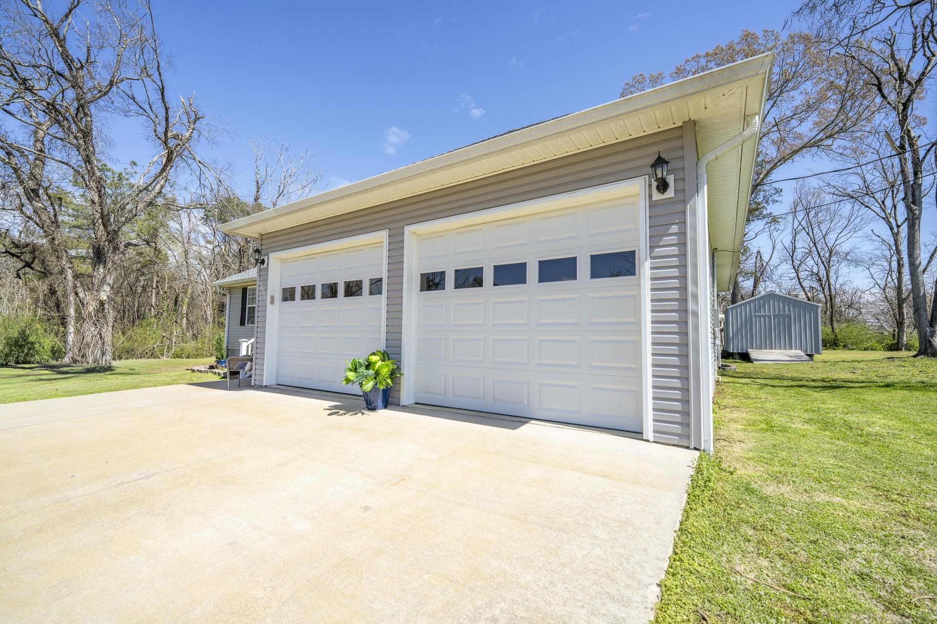 50 Perry Place Savannah, TN 38372 - Photo 36 of 38 a view of a house with backyard and tree