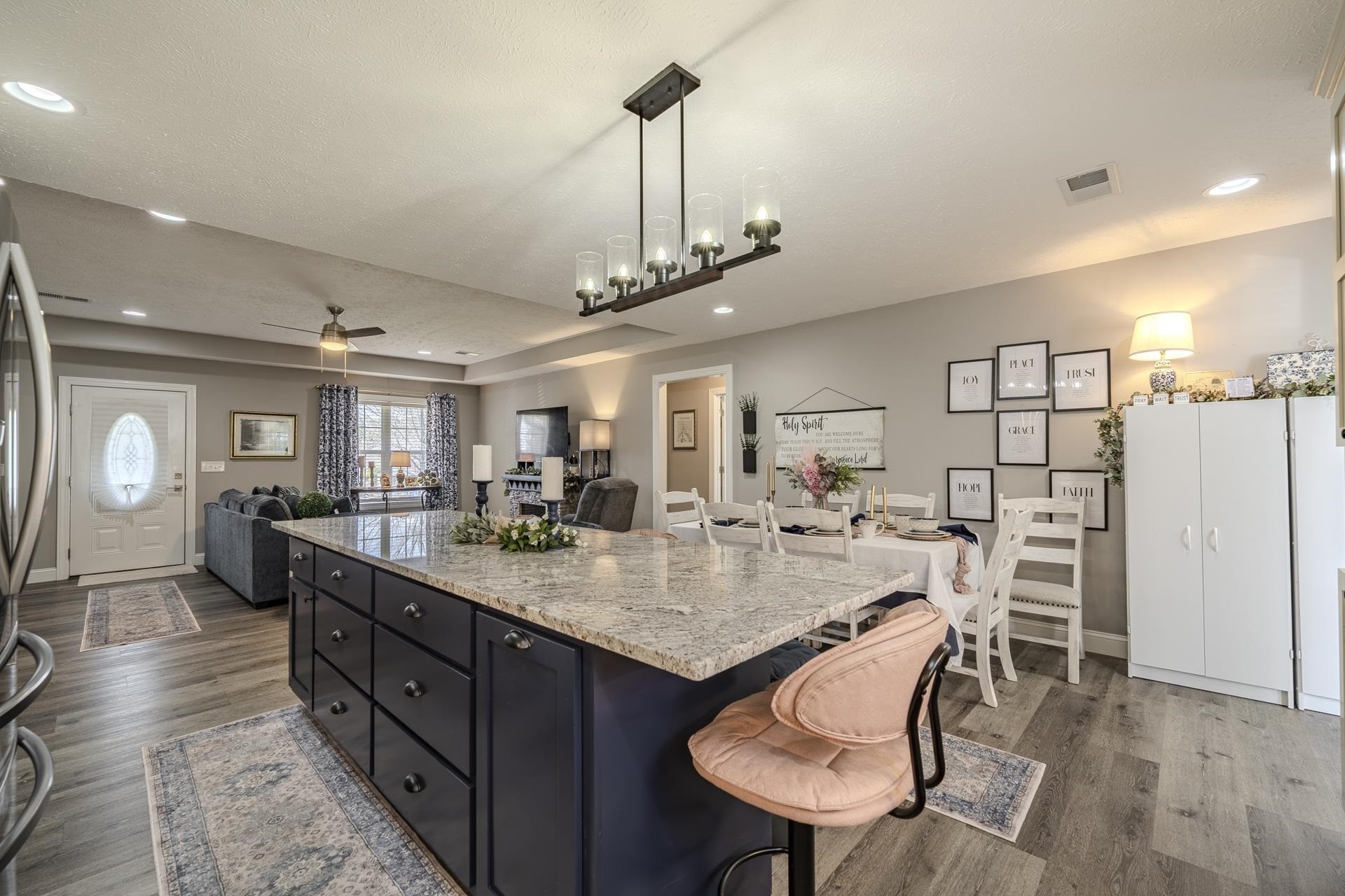 50 Perry Place Savannah, TN 38372 - Photo 5 of 38 a view of a dining room and livingroom with furniture wooden floor a chandelier