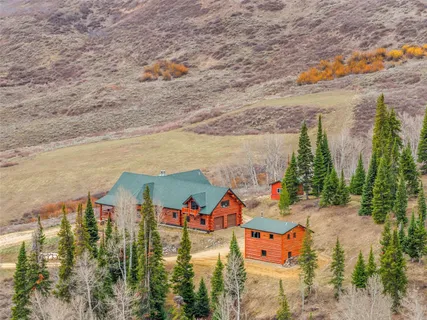an aerial view of a house with outdoor space
