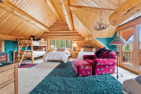 a spacious bedroom with a bed and a couch