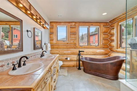 a spacious bedroom with a bed and a couch