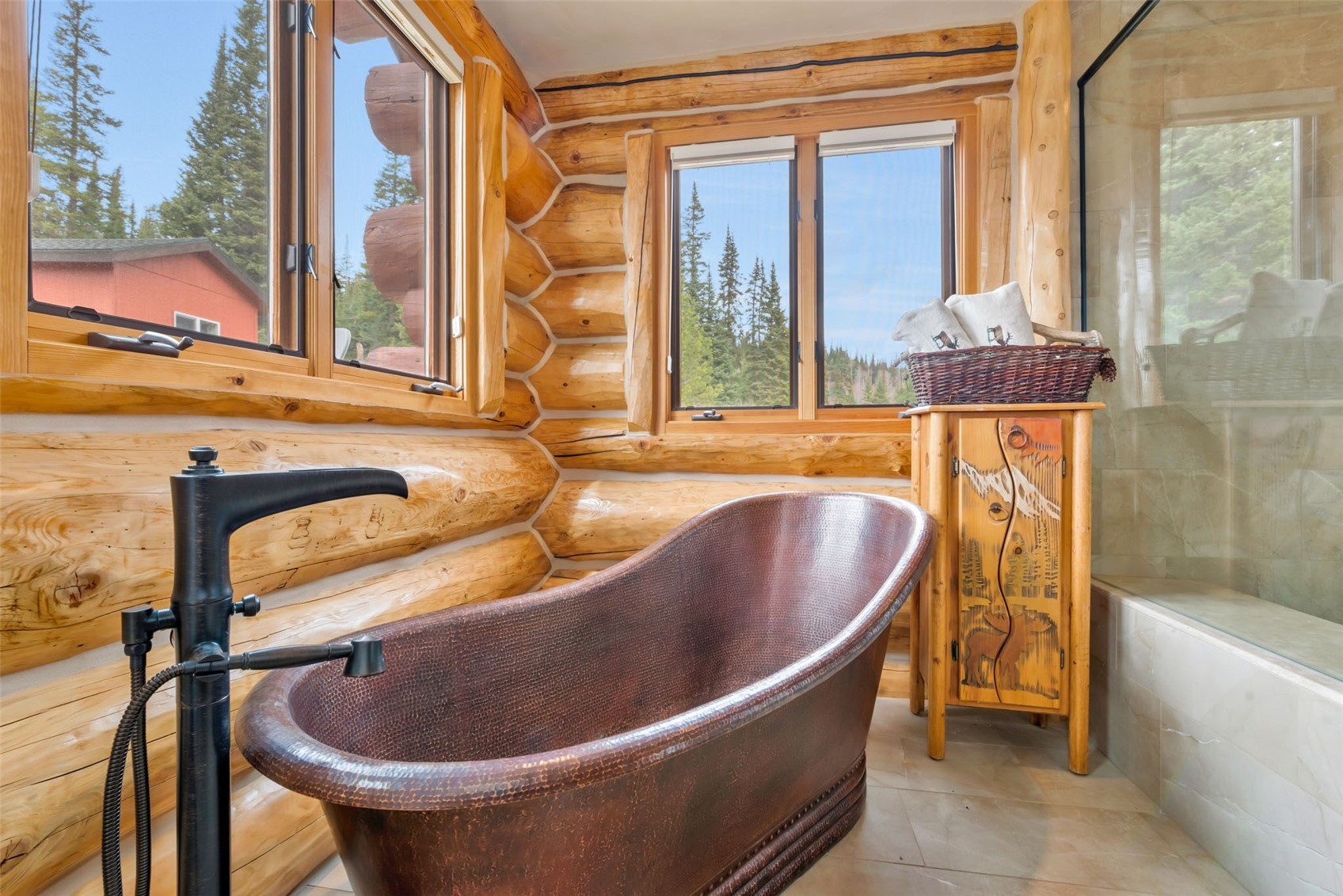 26755 Little Hawk Lane Clark, CO 80428 - Photo 39 of 47 a bath tub sitting in a bathroom next to a window