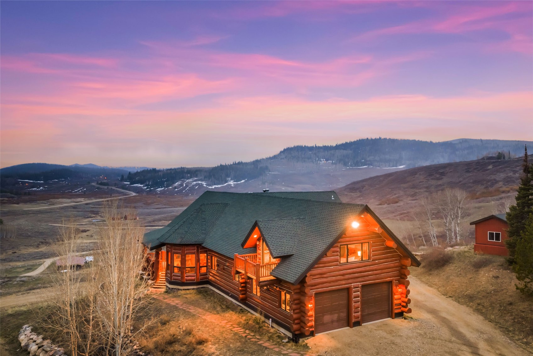 26755 Little Hawk Lane Clark, CO 80428 - Photo 4 of 47 an aerial view of a house with swimming pool and mountains