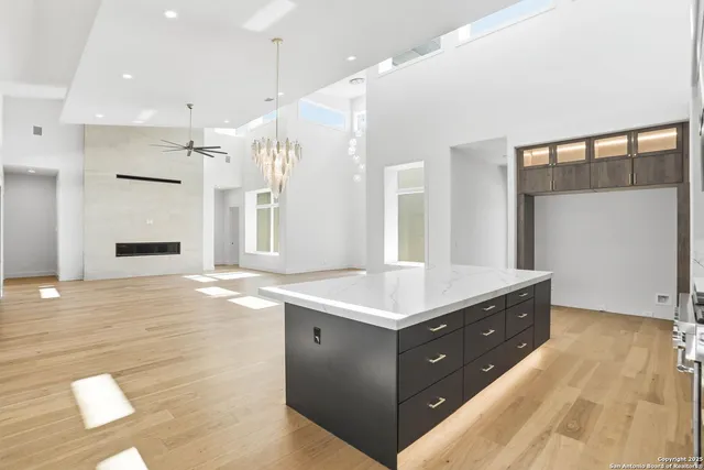 a bathroom with a sink mirror and a shower