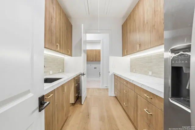a bathroom with a sink and mirror