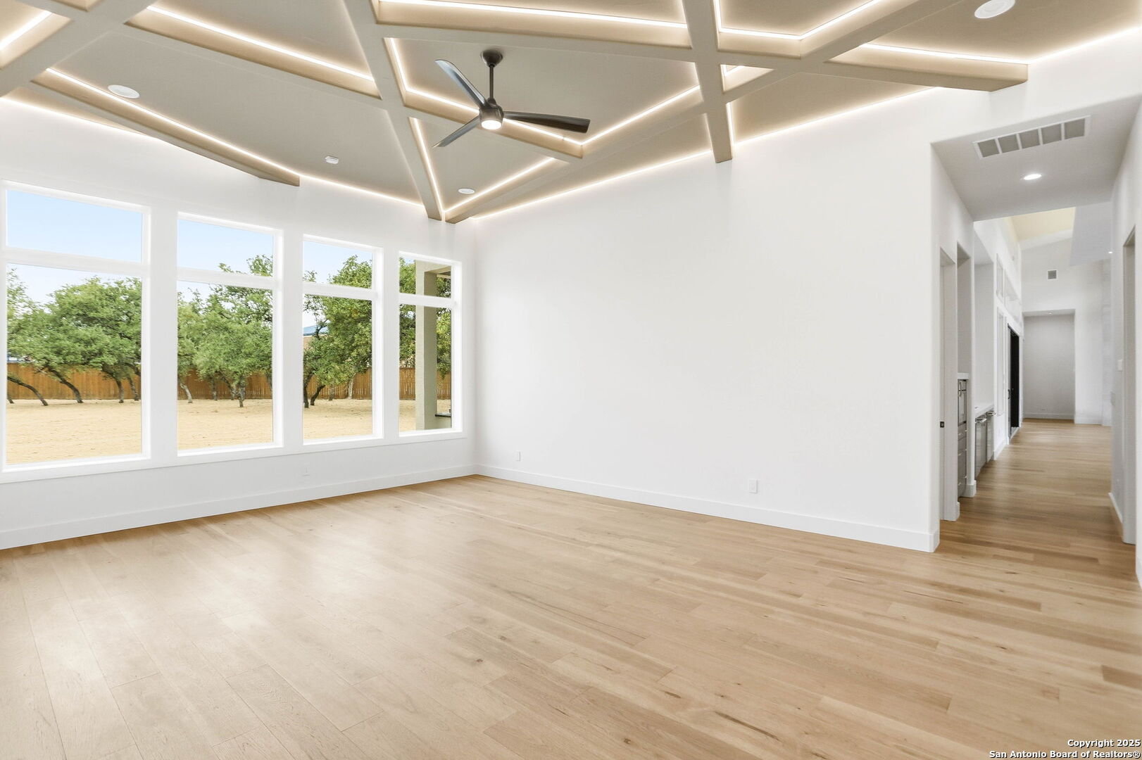 15 Wellesley Loop Shavano Park, TX 78231 - Photo 18 of 48 a view of an empty room with a window and wooden floor