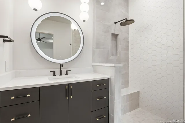 a bathroom with a sink and a mirror