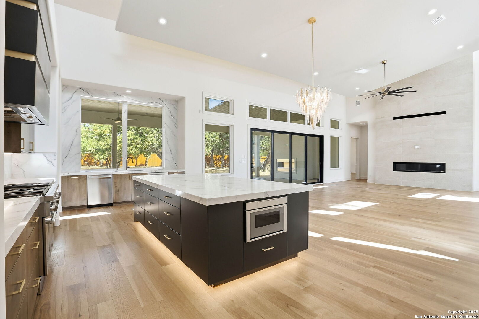15 Wellesley Loop Shavano Park, TX 78231 - Photo 3 of 48 a kitchen with stainless steel appliances granite countertop a stove and a refrigerator