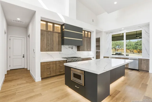 a kitchen with a stove and a sink