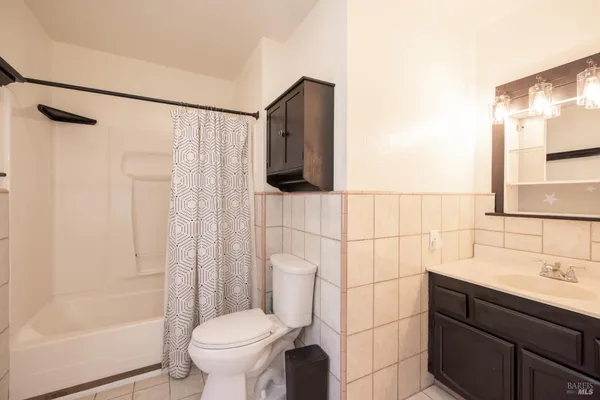 an aerial view of multiple houses with yard