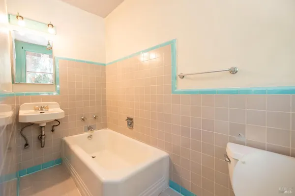 a view of empty room with wooden walls