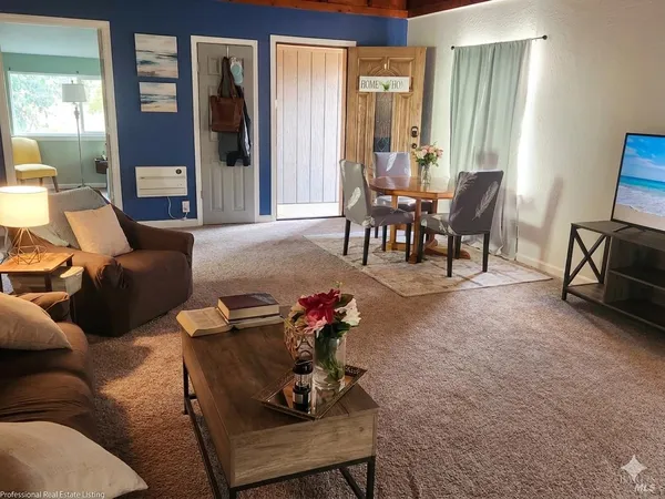 a view of a house with a snow on a road