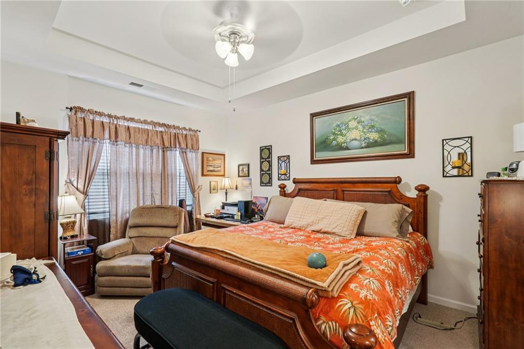 1729 Limousin Way Stockbridge, GA 30281 - Photo 11 of 18 a bedroom with furniture and a large window