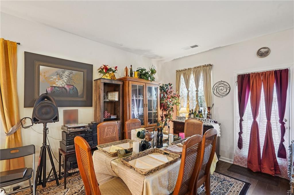 1729 Limousin Way Stockbridge, GA 30281 - Photo 4 of 18 a view of a dining room with furniture and chandelier