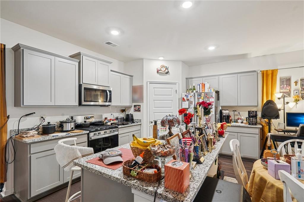 1729 Limousin Way Stockbridge, GA 30281 - Photo 6 of 18 a view of a kitchen with appliances and cabinets