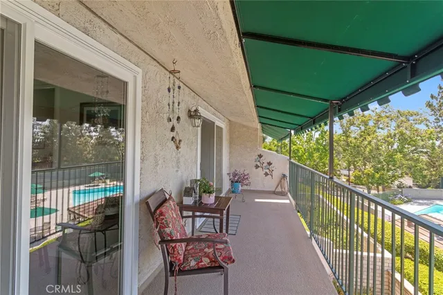 a view of balcony with furniture