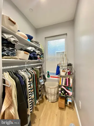 a bed room with a bed and a chair