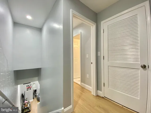 a bedroom with a bed and a mirror