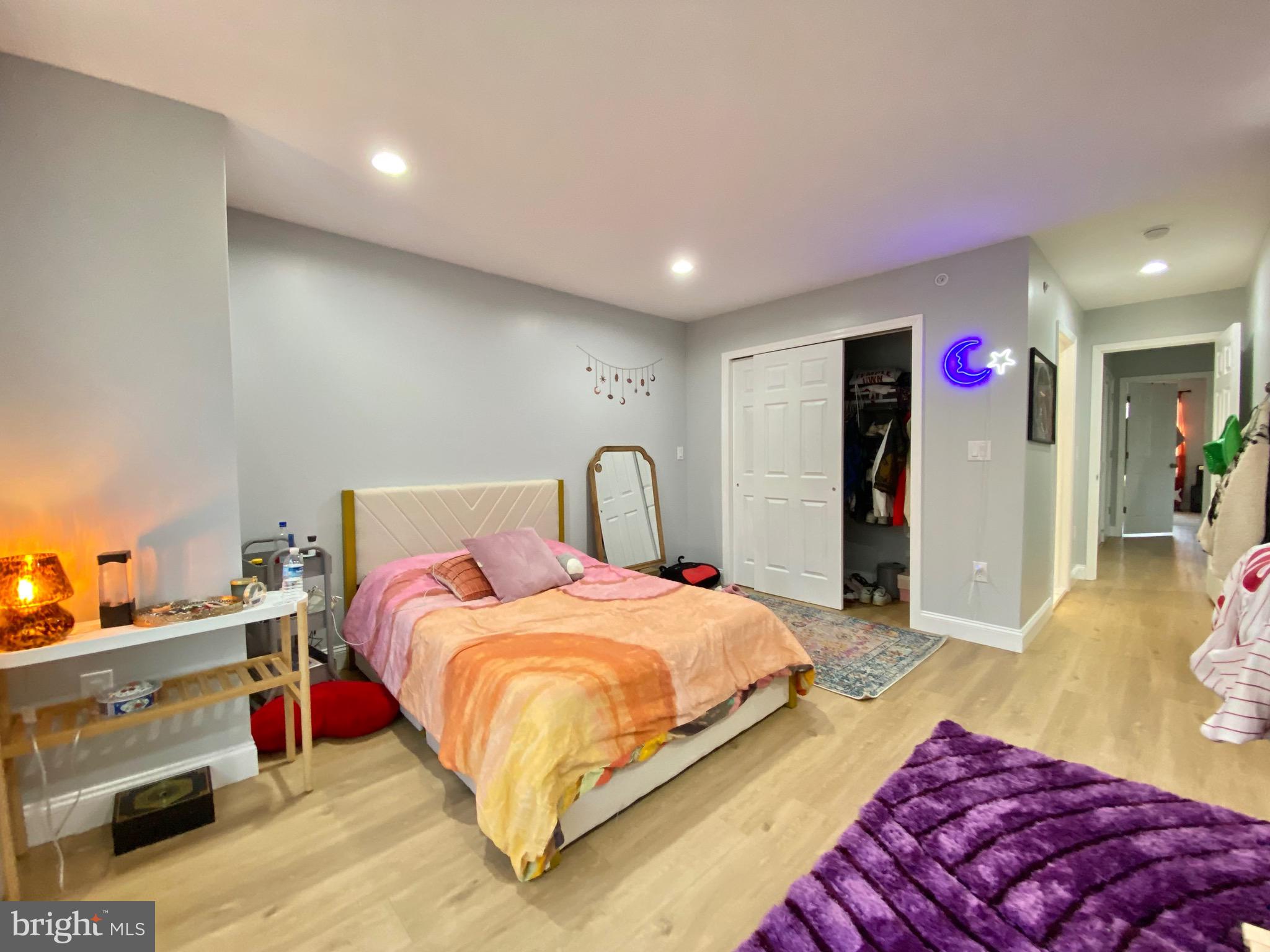 1932 North 8th Street, Unit 2 Philadelphia, PA 19122 - Photo 22 of 34 a spacious bedroom with a bed and a dresser