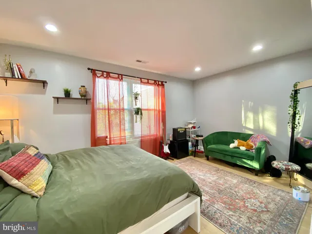 a bedroom with a bed and cabinets