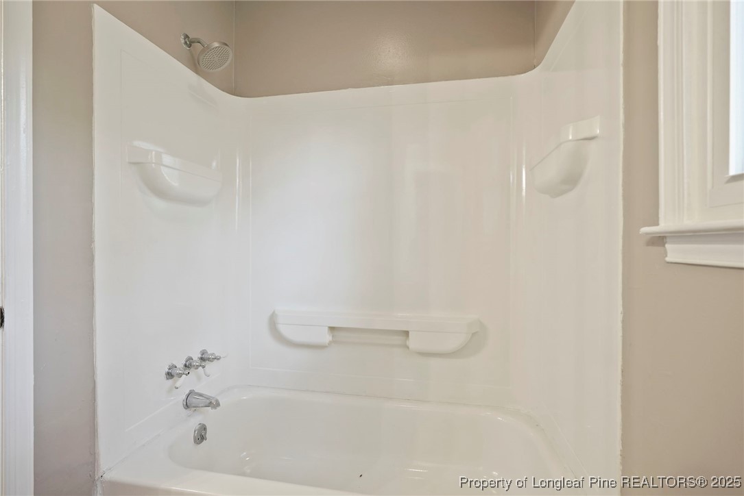 2308 Keith Drive Raleigh, NC 27610 - Photo 17 of 26 a bathroom with a shower